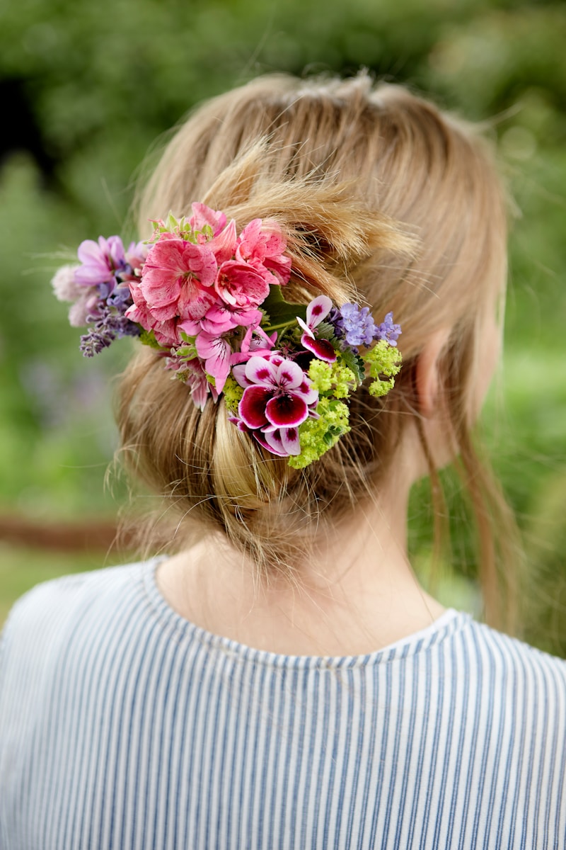 girl in white shirt with pink flower headband